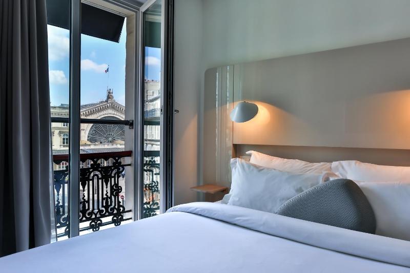 Un ou plusieurs lits dans un hébergement de l'établissement Hôtel Le Marcel Paris Gare de l'Est