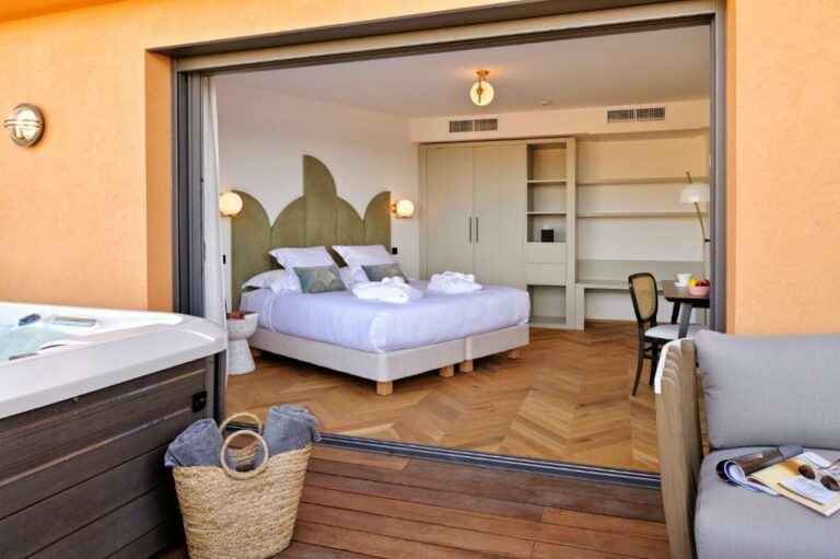 Un ou plusieurs lits dans un hébergement de l’établissement Hôtel Rocabella