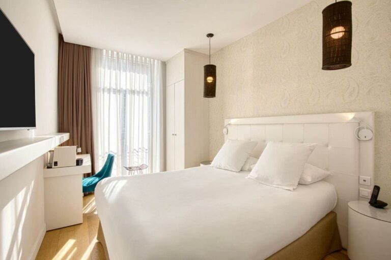 Un ou plusieurs lits dans un hébergement de l’établissement Boa Hotel – BW Signature Collection – Lille Centre Gares