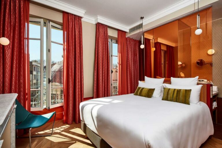 Un ou plusieurs lits dans un hébergement de l’établissement Hotel De Cambis