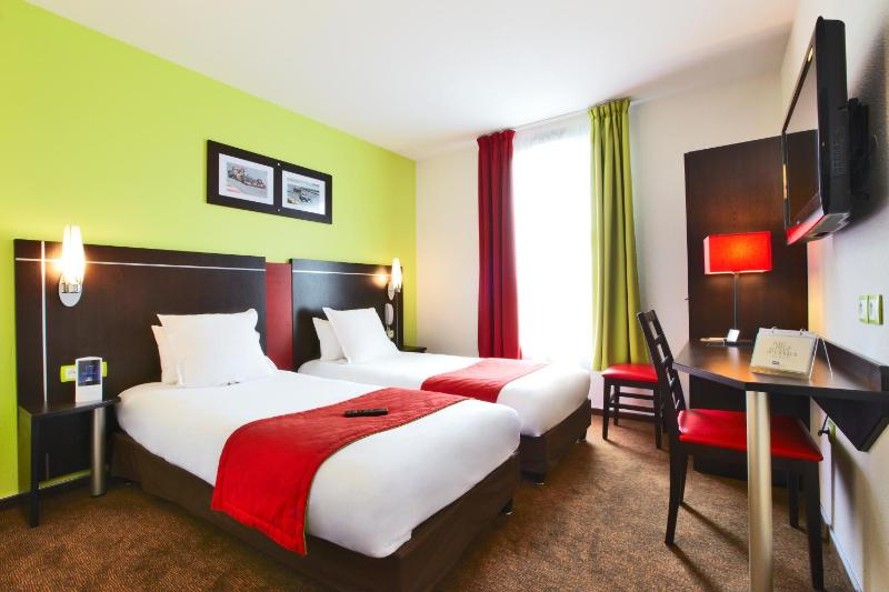 Un ou plusieurs lits dans un hébergement de l'établissement Enzo Hotels Thionville by Kyriad Direct