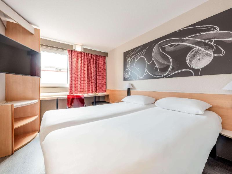 Un ou plusieurs lits dans un hébergement de l'établissement ibis Lille Roubaix Centre Grand-Place