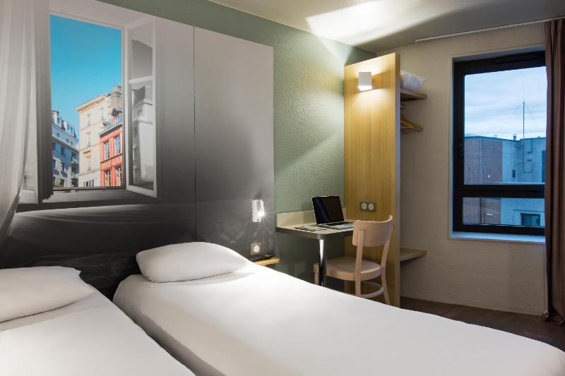 Un ou plusieurs lits dans un hébergement de l'établissement B&B HOTEL Rouen Centre