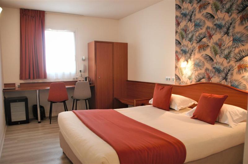 Un ou plusieurs lits dans un hébergement de l'établissement Deltour Hotel Le Puy En Velay